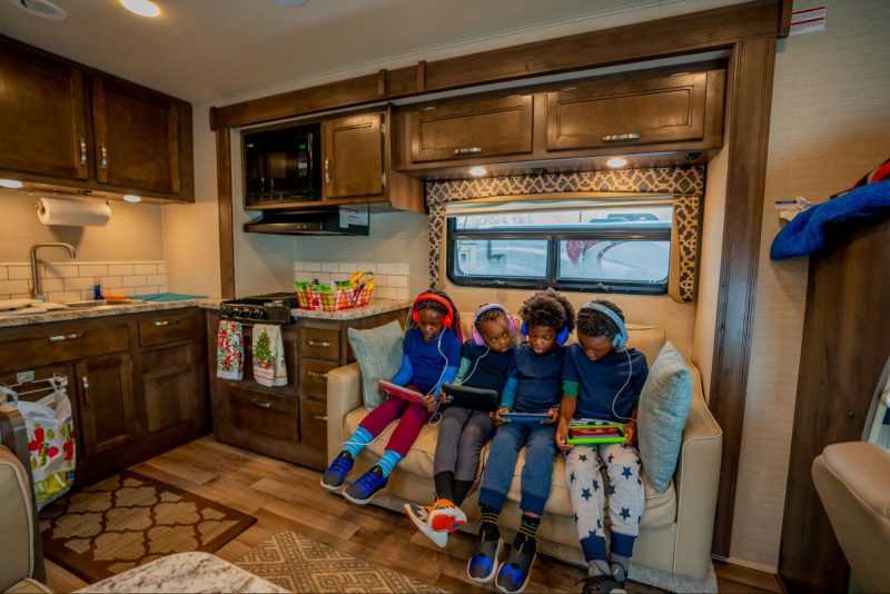 kids playing on ipads in an RV