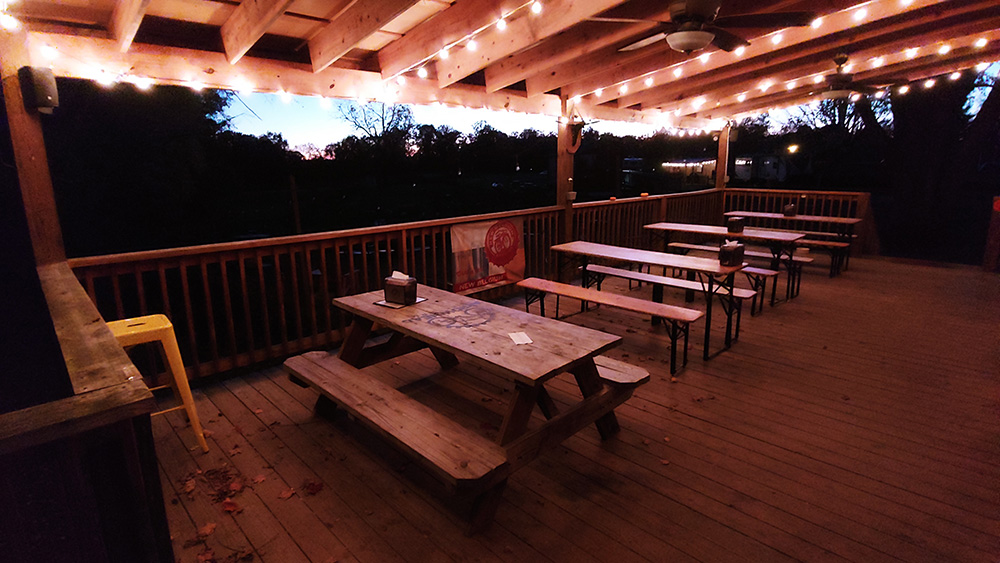 picnic tables on a porch