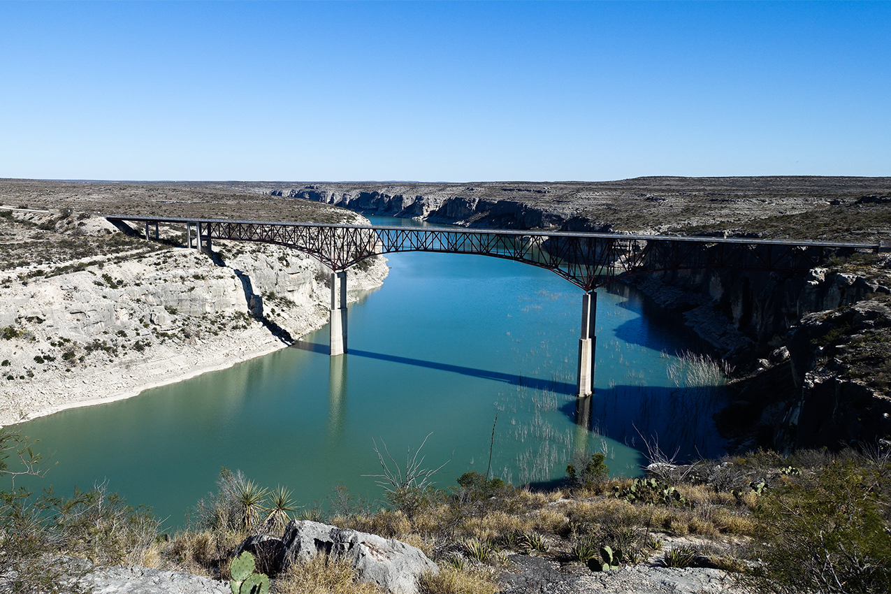 Bridge over a river in a canyon.