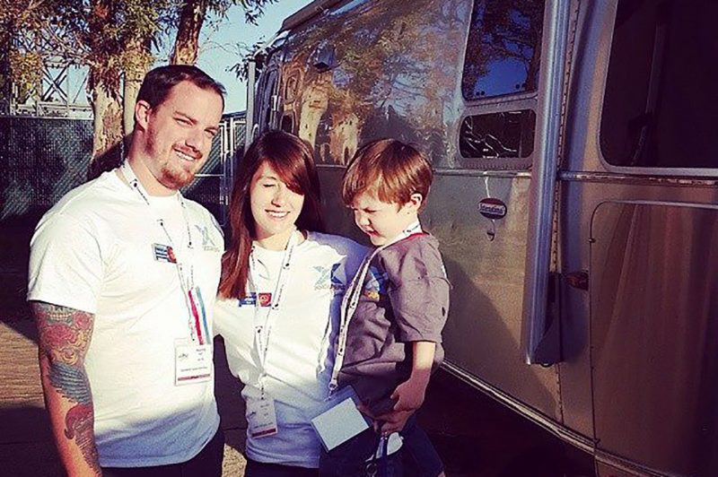 Mel and Travis next to their Airstream