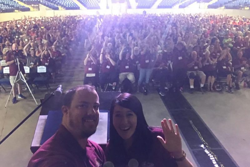 Mel and Travis in front of a big audience