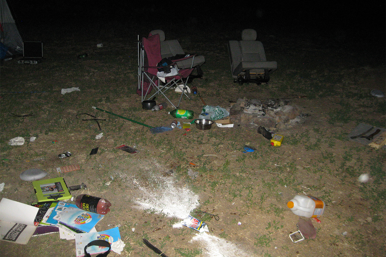 Campsite covered in trash.