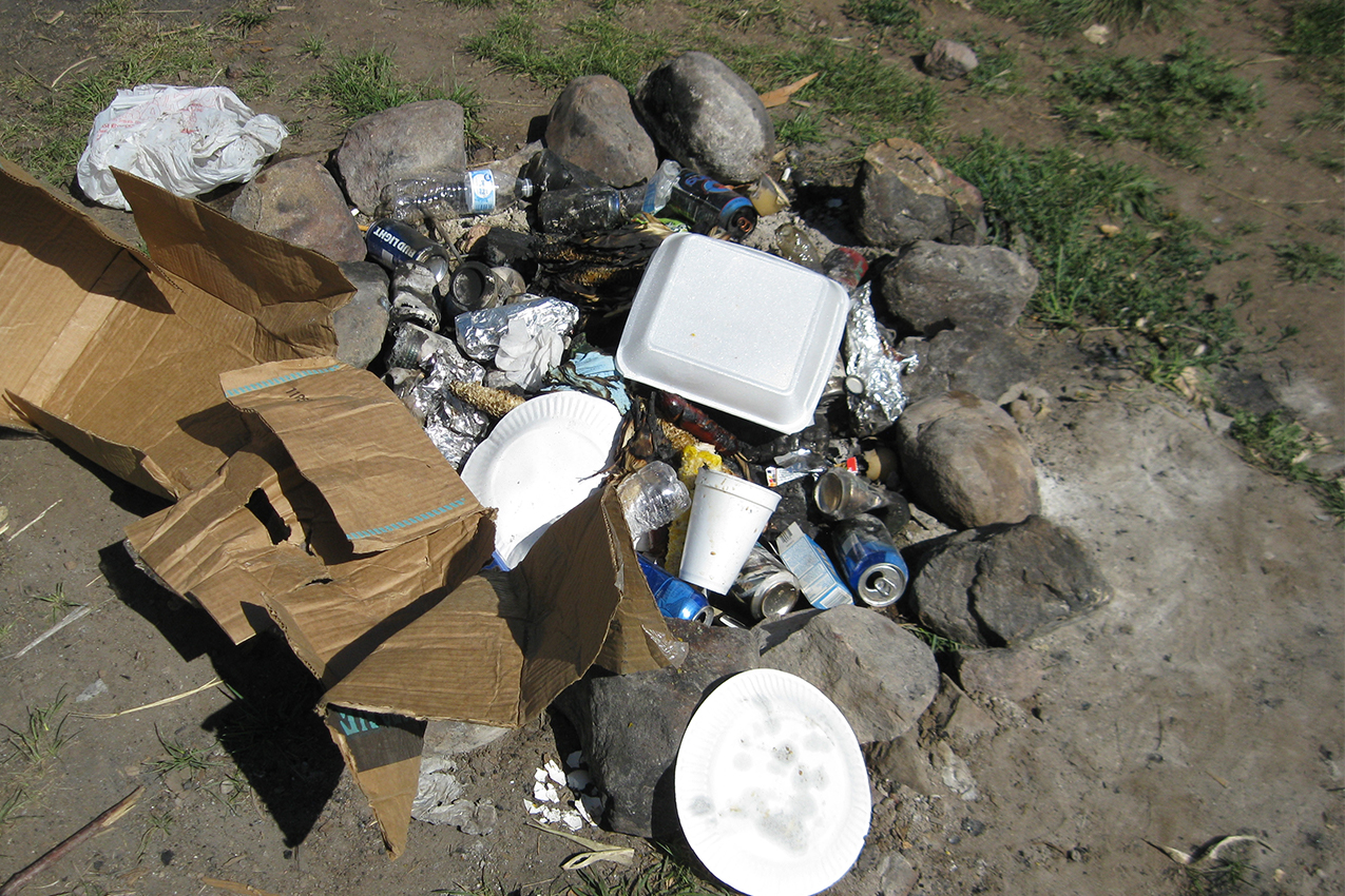 Fire pit filled with trash.