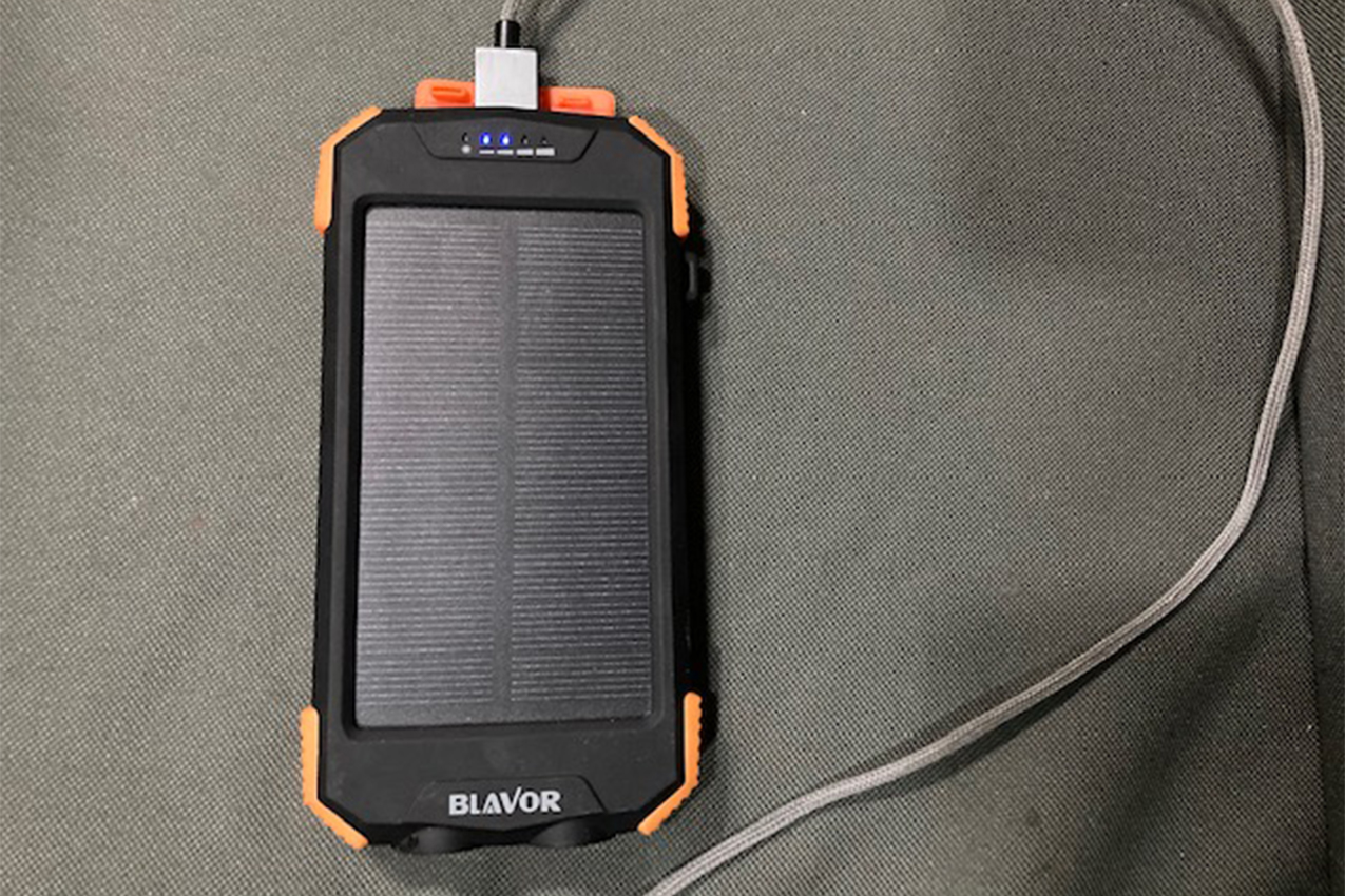 Solar panel with USB cord plugged into it