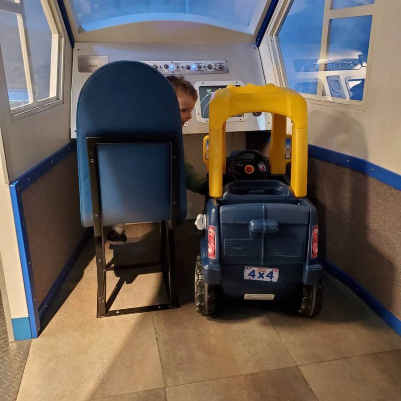 boys in a toy airplane