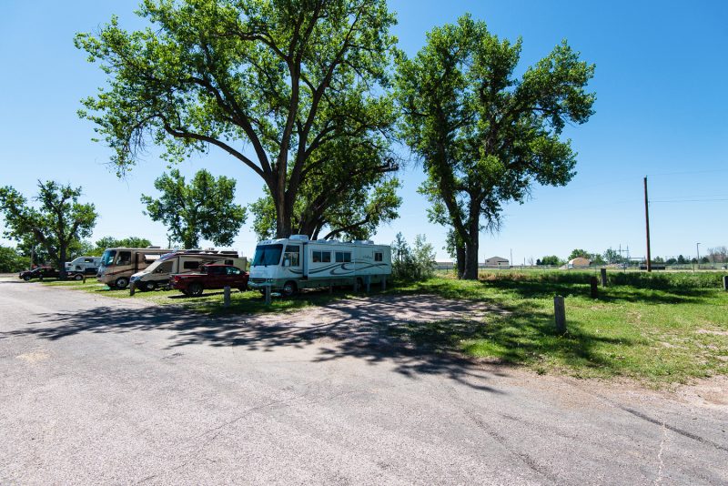 Several RVs parked in campground in town.