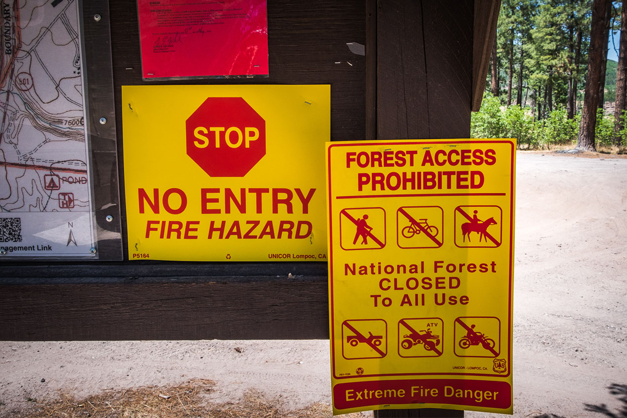 Signs about forest closures due to fire hazards.
