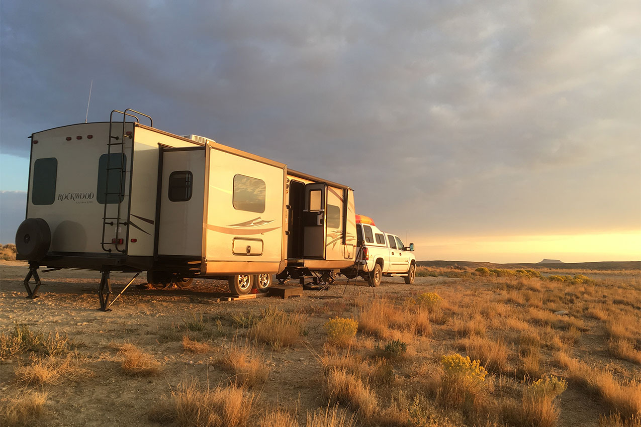 RV parked during sunset.