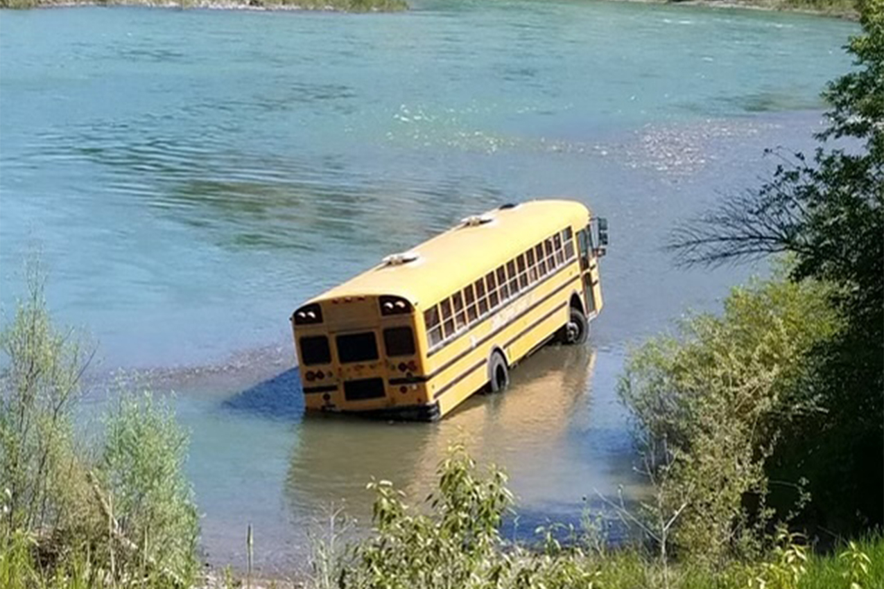 Bus stuck in the river.