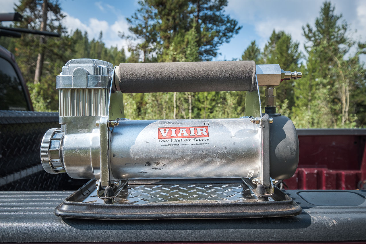 Viair portable compressor on the back of a truck.