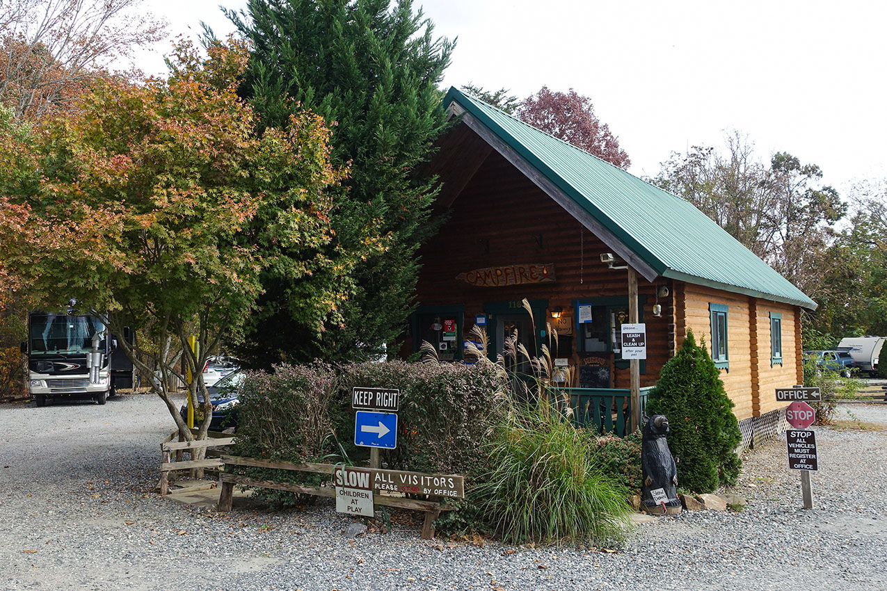 RV park office surrounded by trees.