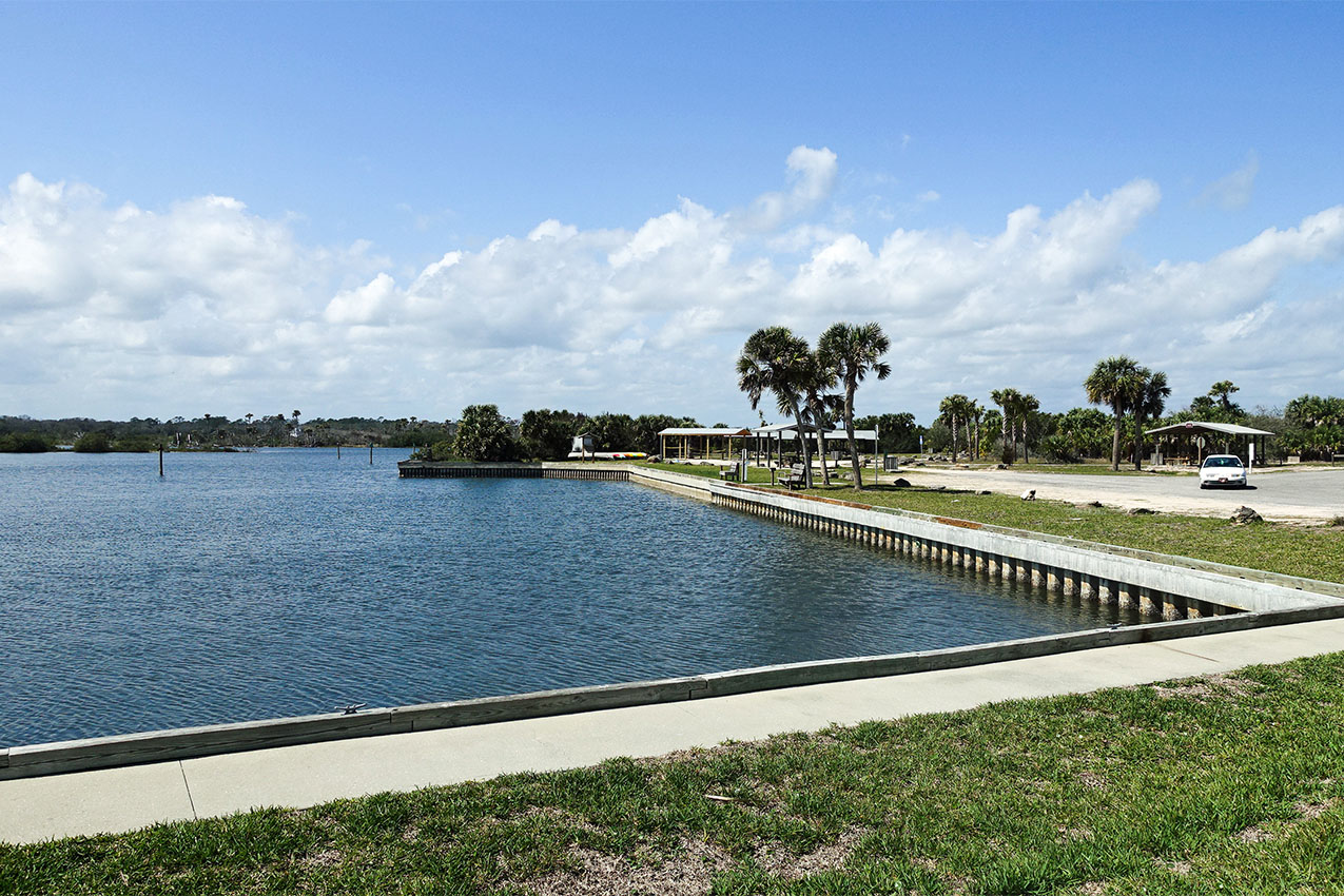 Concrete walkway around a river.