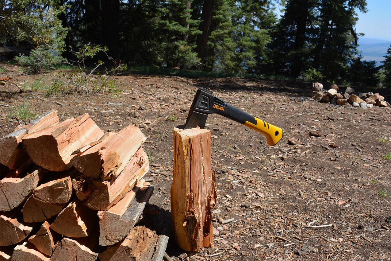 An axe tossed into a log.