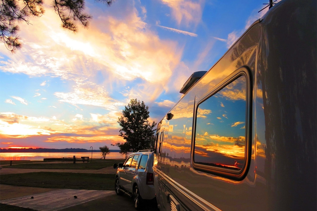 Sunset and clouds reflected in the window of RV windows.