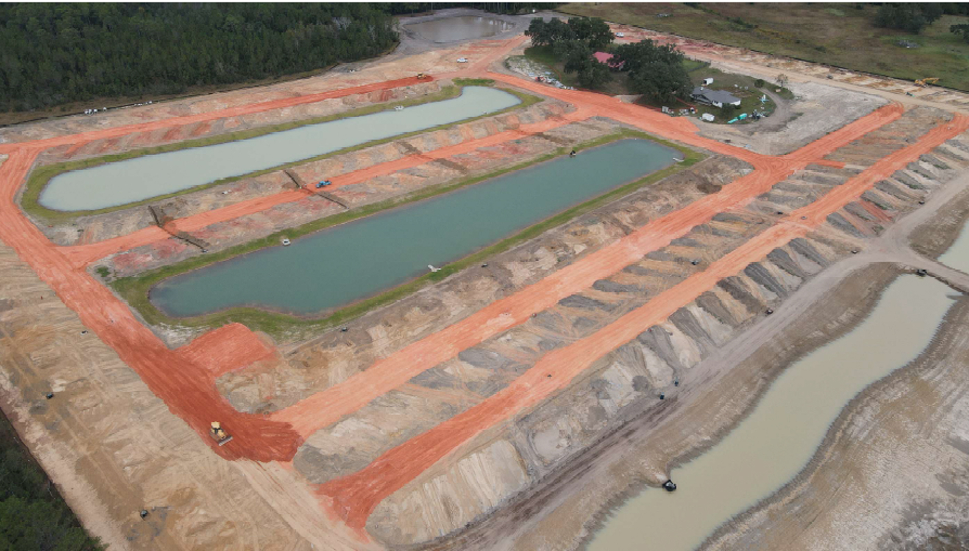 Aerial view of campground under construction with sites outlined