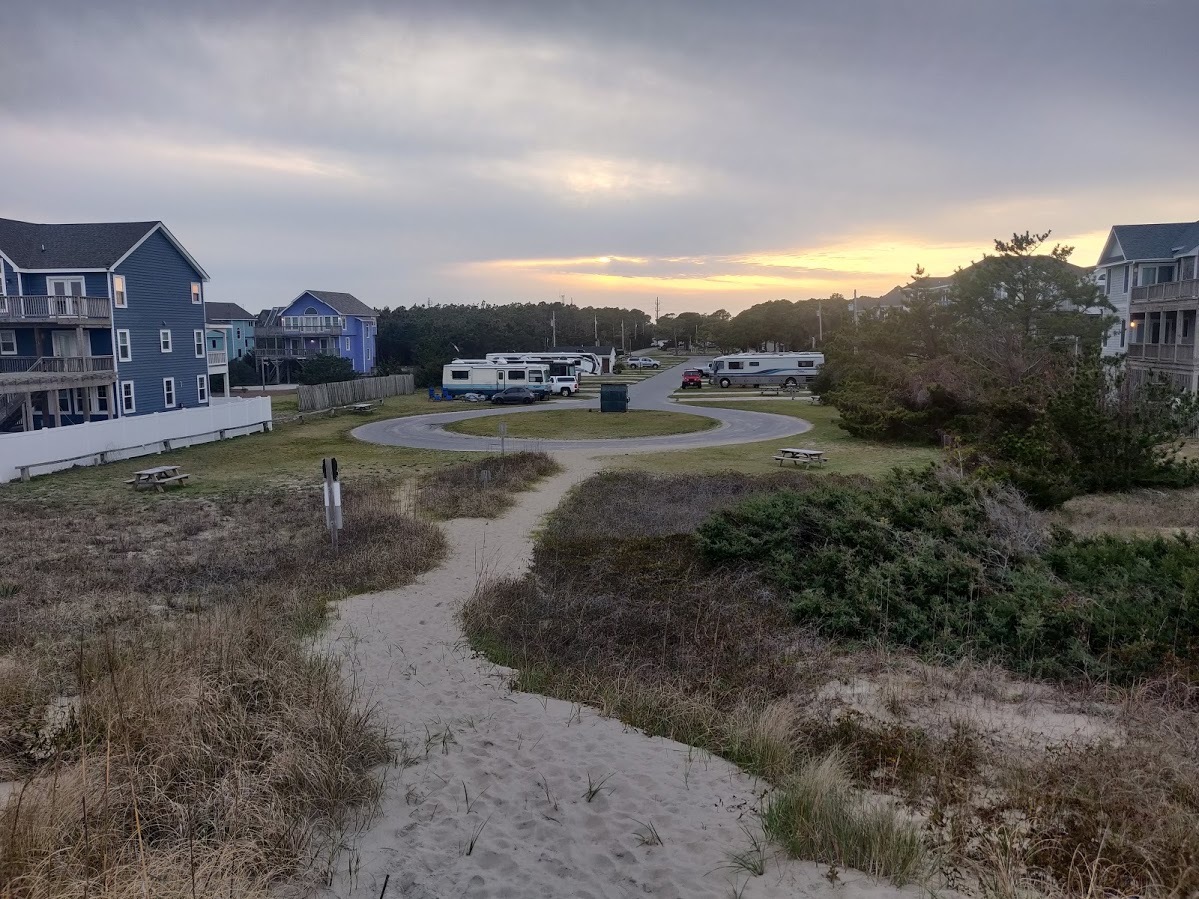 RVs parked by a beach in North Carolina at the Ocean Waves campground