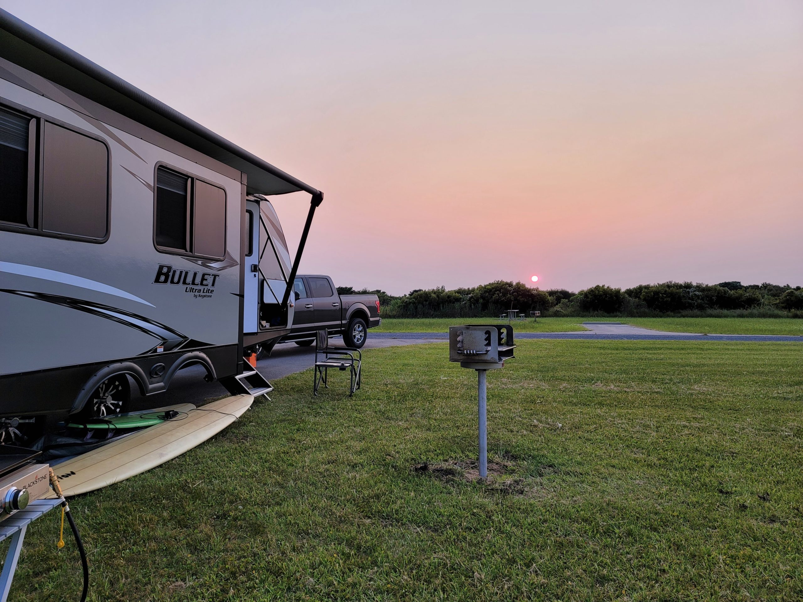 RV and truck parked at a campsite at Cape Point Campground