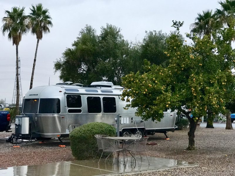 Airstream travel trailer parked at an RV campground in Arizona.