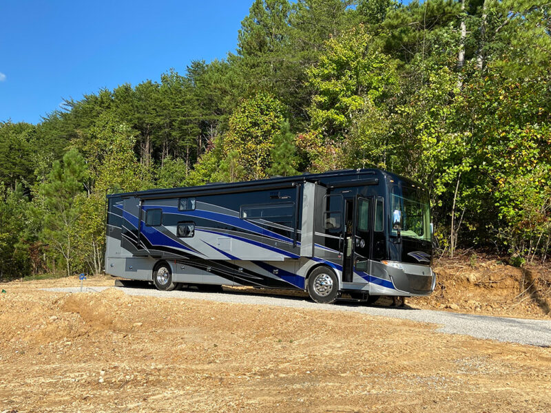 Motorhome parked next to some trees