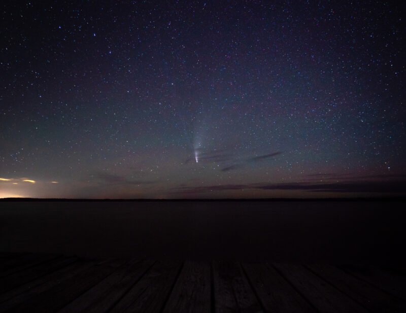 a night sky with stars and streaks of light
