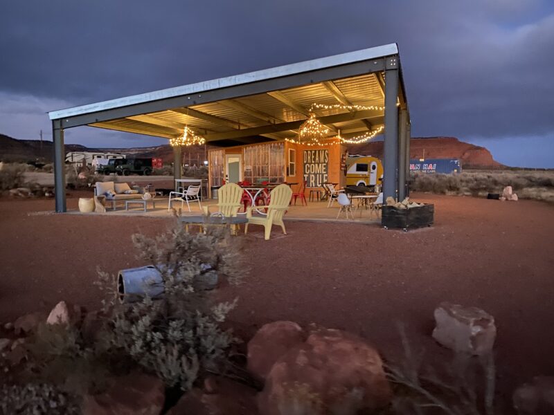 Lighted chandeliers hang from the roof of a charming, shared gathering place at a Dark Sky campground.