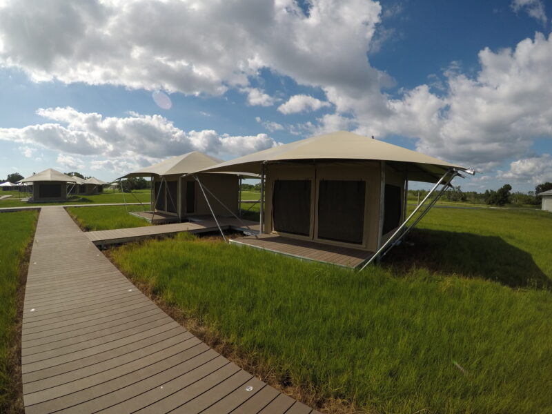 Futuristic looking tents offer screened siding to help keep insects at bay.