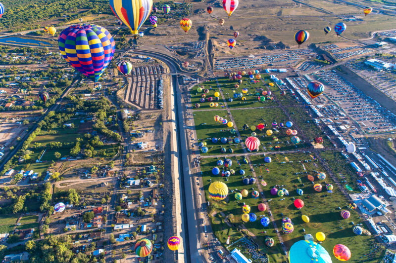Multiple air balloons launching into the sky at the Alubuqurque Balloon Festival