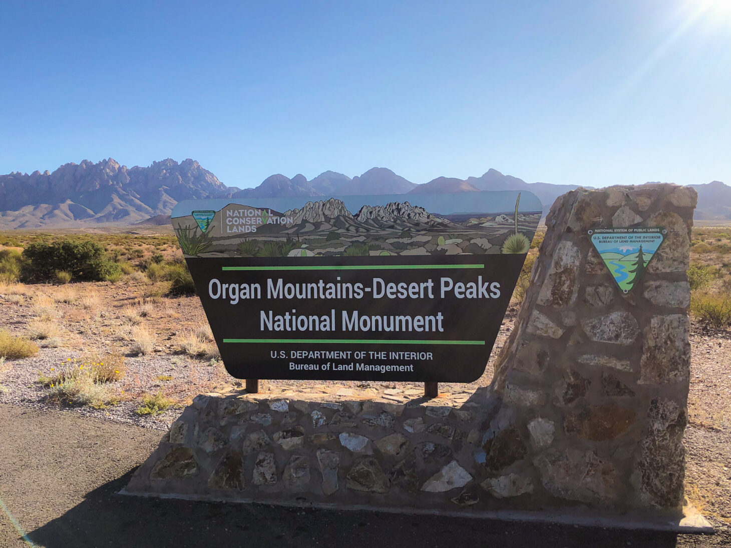 Entrance sign to national monument that reads "Organ Mountains-Desert Peaks National Monument"