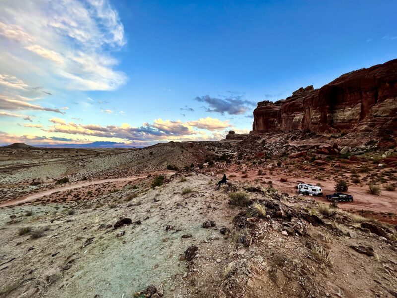 Towering red rock cliffs are the setting for a dispersed campsite in Moab, Utah