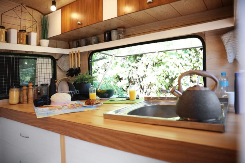 Interior view of stocked RV kitchen